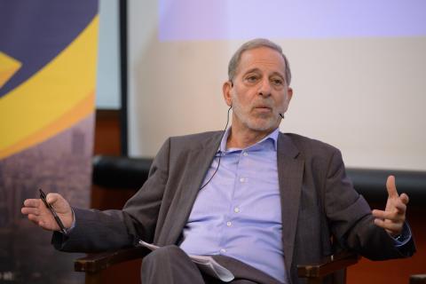 A man is sitting on a chair and talking