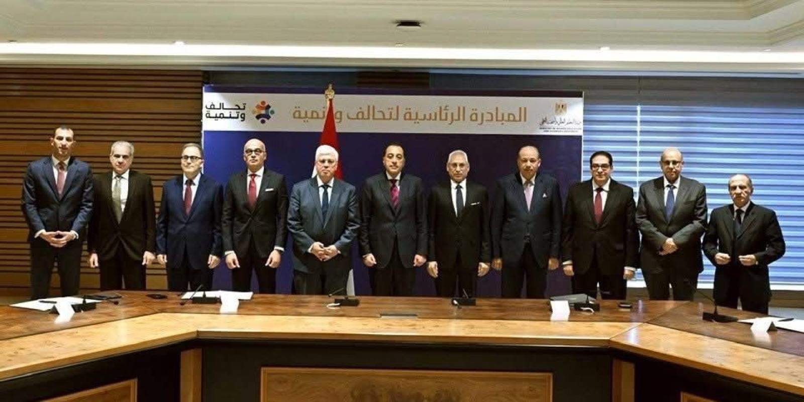 AUC President Ahmad Dallal, Professor Yehea Ismail and Hala Barakat are standing beside the Prime Minister and Minister of Higher Education and Scientific Research