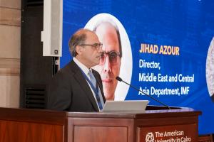 IMF Director Jihad Azour speaking at an AUC podium