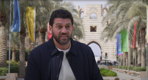 A man is atlking in a garden